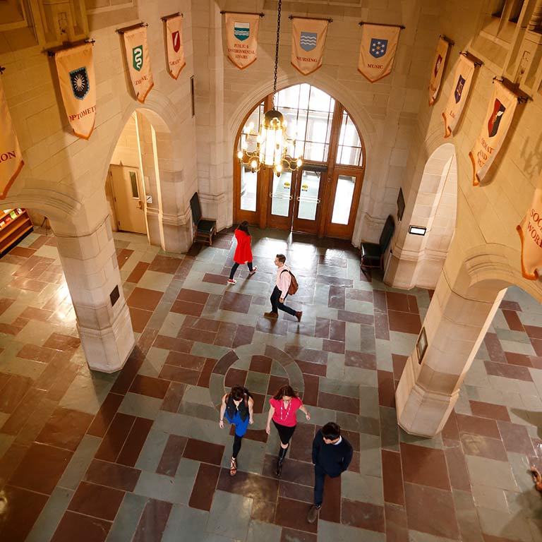A birds-eye-view inside the Indiana Memorial Union, where students walk through the hallway below.